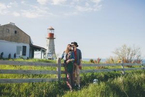young-couple-hipster-indie-style-love-walking-countryside-holding-hands-lighthouse-background-warm-summer-day-sunny-bohemian-outfit-hat_285396-2583